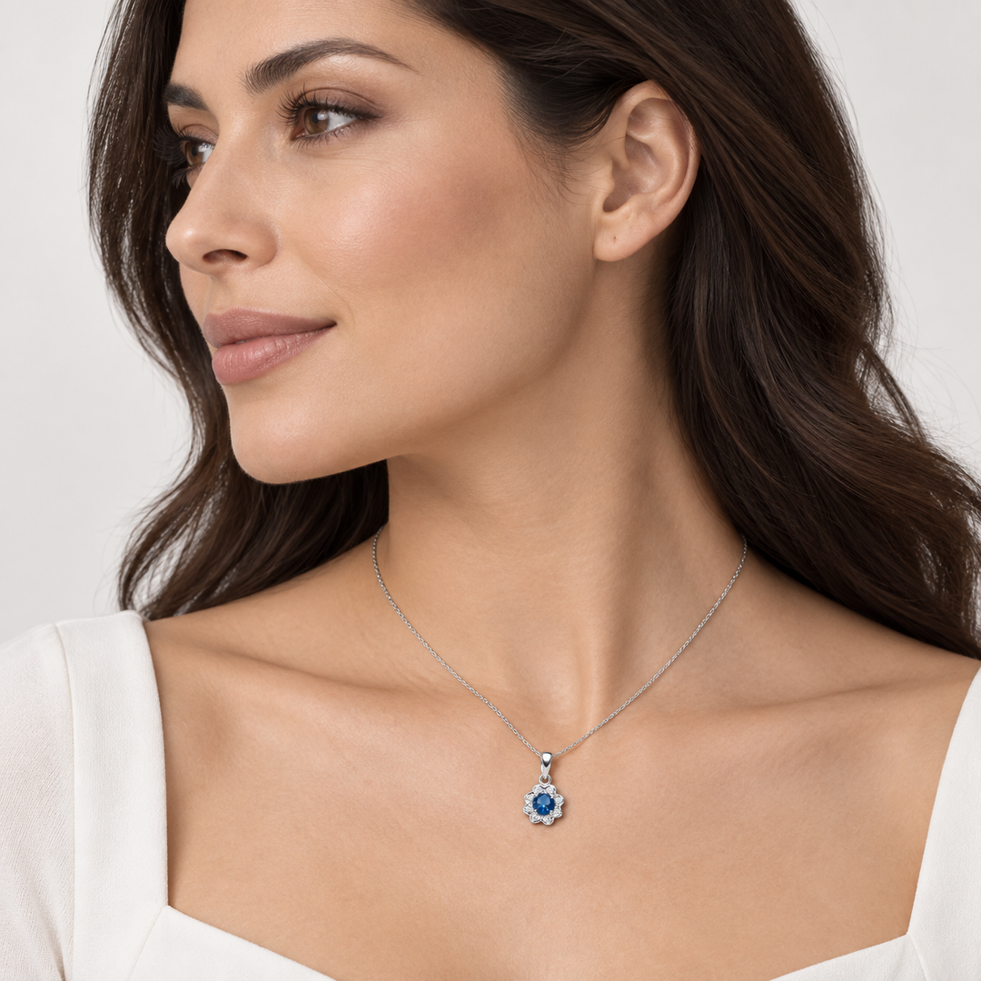 Created Blue Topaz and Cubic Zirconia Floral Pendant in Rhodium-Plated Sterling Silver