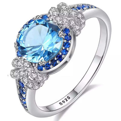 Topaz Simulant Halo Silver Ring