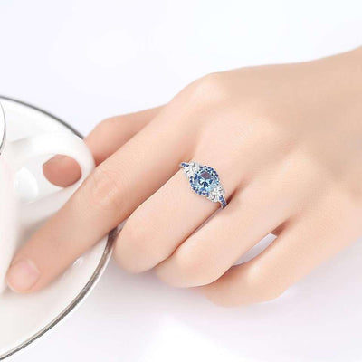 Topaz Simulant Halo Silver Ring