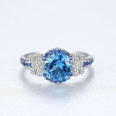 Topaz Simulant Halo Silver Ring